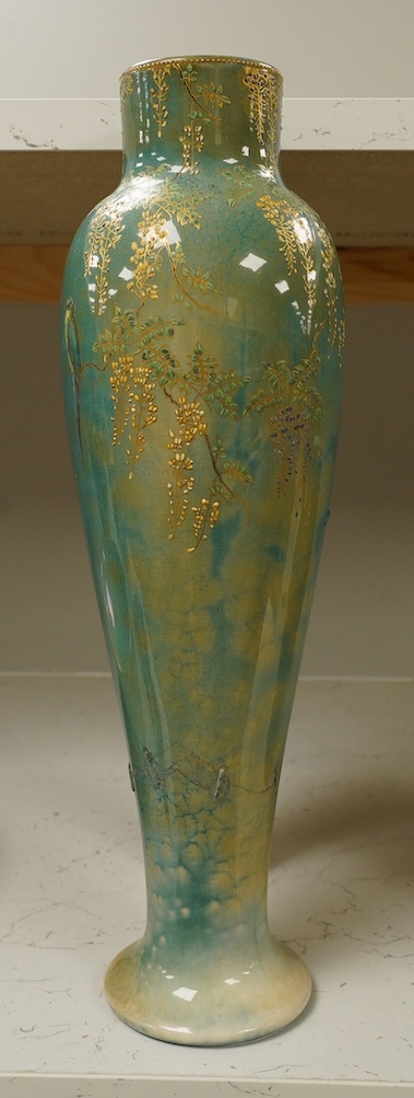 A Doulton Titanian ‘parakeet’ vase with raised floral and leaf design, 37cm high. Condition - considerable stapled restoration